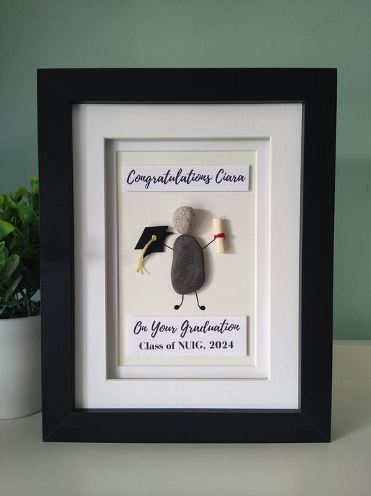 A personalized congratulatory artwork frame, with a graduation cap and a diploma design, and the text 'CONGRATULATIONS ON YOUR GRADUATION CLASS OF 2024'.